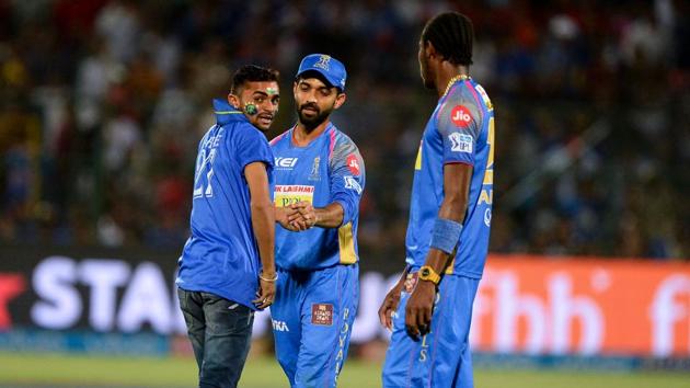 A fan of Ajinkya Rahane (C) enters the pitch to take a selfie during the 2018 Indian Premier League (IPL 2018) match between Rajasthan Royals and Kings XI Punjab at the Sawai Mansingh Stadium in Jaipur on Tuesday (May 8). (AFP) A fan of Ajinkya Rahane (C) enters the pitch to take a selfie during the 2018 Indian Premier League (IPL 2018) match between Rajasthan Royals and Kings XI Punjab at the Sawai Mansingh Stadium in Jaipur on Tuesday (May 8). (AFP)