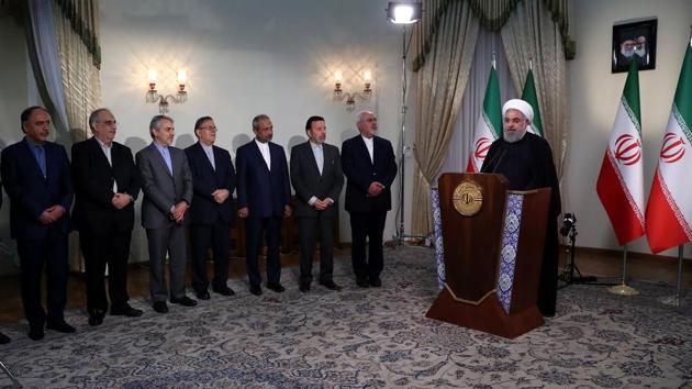 A handout picture provided by the Iranian presidency on May 8, 2018 shows President Hassan Rouhani standing near members of his government while giving a speech on Iranian TV in Tehran. (AFP) A handout picture provided by the Iranian presidency on May 8, 2018 shows President Hassan Rouhani standing near members of his government while giving a speech on Iranian TV in Tehran. (AFP)
