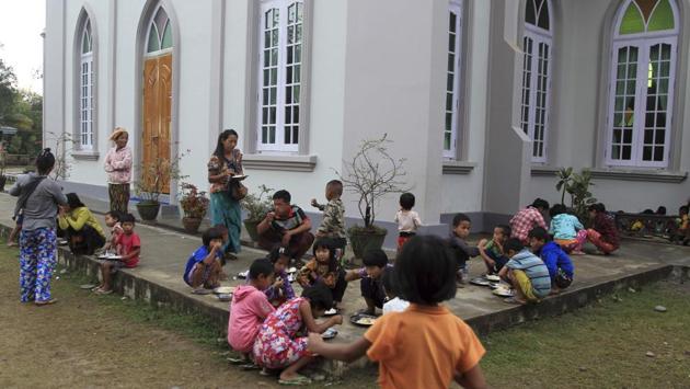 One group of 2,000 villagers has been trapped in the jungle since mid-April without proper food, water, shelter and medical care, unable to get through army roadblocks to safer refuge. For those who do eventually reach safety, they often end up in church halls like the one at Trinity Baptist Church just outside Myitkyina. That’s were Nlam Numrang Doi and her neighbors ended up after their escape by boat. (Min Kyi Thein / AP)