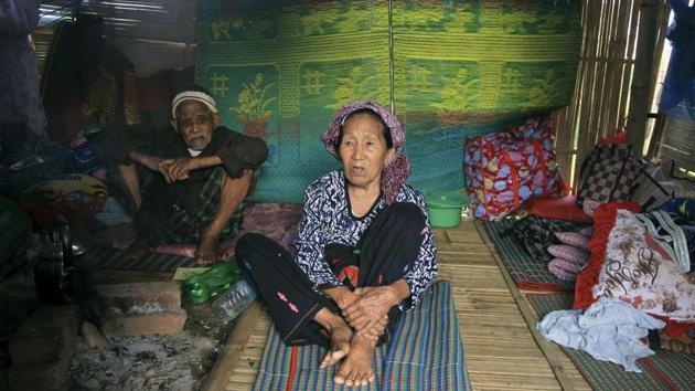 As the Myanmar army’s bombs started falling near her home in Kachin state, Nlam Numrang Doi (C) and her neighbors decided they had no choice but to grab what they could and scatter into the jungle. “We were in so much trouble, I couldn’t even swallow my food,” the 92-year-old recalled. “If we stayed in the village, we didn’t know what could happen to us.” (Min Kyi Thein / AP)