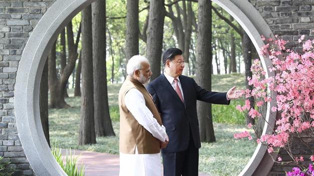 A file photo of PM Modi and Chinese President Jinping at a garden in Wuhan, China from April. “India and China should resume military exchanges and strategic communication between top commanders to maintain peace and tranquillity in the border areas,” India’s envoy to China Gautam Bambawale said on Wednesday. (AP File) A file photo of PM Modi and Chinese President Jinping at a garden in Wuhan, China from April. “India and China should resume military exchanges and strategic communication between top commanders to maintain peace and tranquillity in the border areas,” India’s envoy to China Gautam Bambawale said on Wednesday. (AP File)