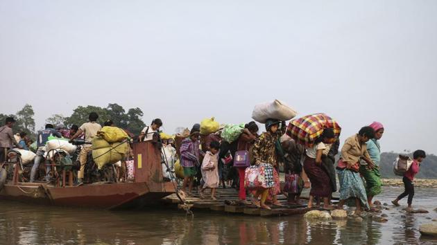 Displaced Kachin residents cross the Malikha river on a ferry near the border with China. “What we are seeing in Kachin state over the past few weeks is wholly unacceptable, and must stop immediately,” Yanghee Lee, the UN’s human rights expert for Myanmar, said last week. “Innocent civilians are being killed and injured, and hundreds of families are now fleeing for their lives.” (Zau Ring Hpara / AFP File)