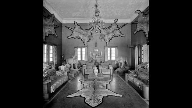 Trophy room in a private residence, 1980, Silver gelatin print. Fascinated by a “cultural osmosis”, Moore captures the effect of British and European architecture on Indian buildings, and that of India on the styles of the British. Homes for instance, show a sense of space and grandeur with higher ceilings, larger windows and corridors and lavish detail, rarely seen in Britain. (©Derry Moore / Courtesy Tasveer) Trophy room in a private residence, 1980, Silver gelatin print. Fascinated by a “cultural osmosis”, Moore captures the effect of British and European architecture on Indian buildings, and that of India on the styles of the British. Homes for instance, show a sense of space and grandeur with higher ceilings, larger windows and corridors and lavish detail, rarely seen in Britain. (©Derry Moore / Courtesy Tasveer)
