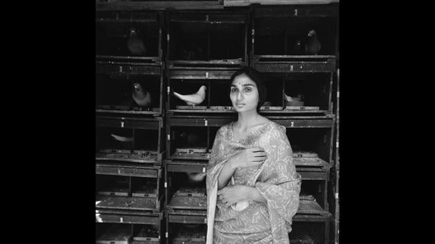 Girl, (Amrita Patel), with homing pigeons, New Delhi, 1976, Silver gelatin print. Serving as commentaries on the complex effects of colonialism on the fabric of Indian society, customs and life, Moore’s photographs manage a timeless preservation of a young nation caught in the throes of transformation – political, social and technological. (©Derry Moore / Courtesy Tasveer) Girl, (Amrita Patel), with homing pigeons, New Delhi, 1976, Silver gelatin print. Serving as commentaries on the complex effects of colonialism on the fabric of Indian society, customs and life, Moore’s photographs manage a timeless preservation of a young nation caught in the throes of transformation – political, social and technological. (©Derry Moore / Courtesy Tasveer)