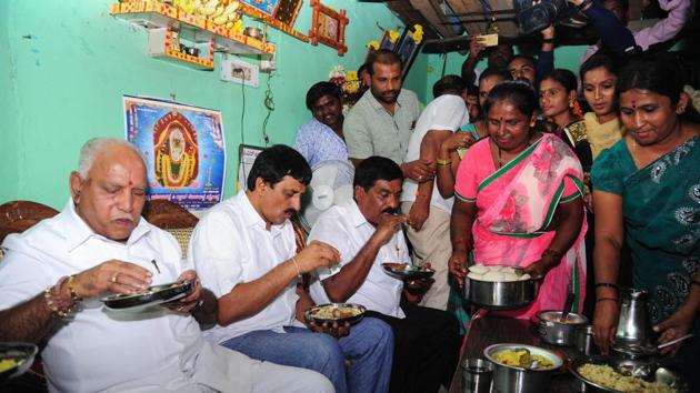 Throughout the campaign, the Bharatiya Janata Party has made several attempts to woo Dalits with top leaders including BS Yeddyurappa staying in Dalit homes. (PTI file photo) Throughout the campaign, the Bharatiya Janata Party has made several attempts to woo Dalits with top leaders including BS Yeddyurappa staying in Dalit homes. (PTI file photo)