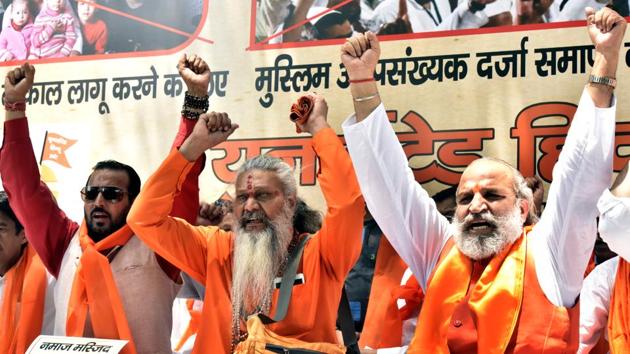 Jai Bhagwan Goyal (C) along with other members of United Hindu Front raise slogans during a protest against offering of namaz in public places at Parliament Street, New Delhi on Wednesday. (Sonu Mehta /HT Photo)