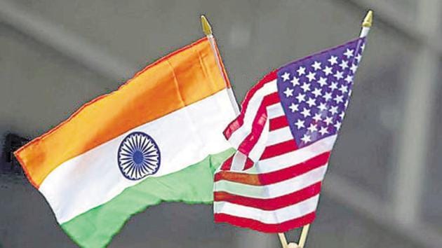 A man holds the flags of India and the U.S. while people take part in the 35th India Day Parade in New York August 16, 2015. REUTERS/Eduardo Munoz - RTX1OFFQ(Reuters file photo)