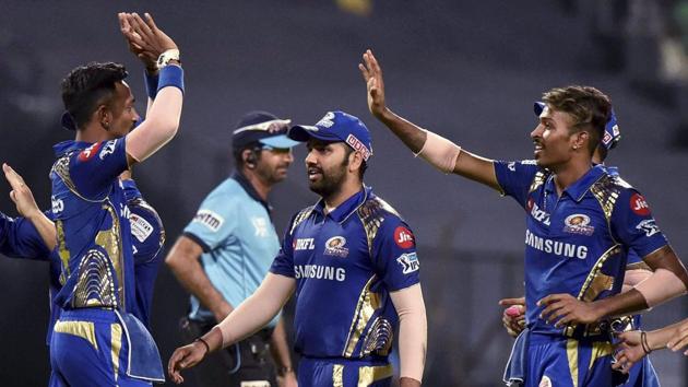 Kolkata: Mumbai Indians' captain Rohit Sharma (C) celebrates with teammates Krunal Pandya (L) and Hardik Pandya after winning the IPL 2018 match against Kolkata Knight Riders at Eden Garden in Kolkata on Wednesday. (PTI)