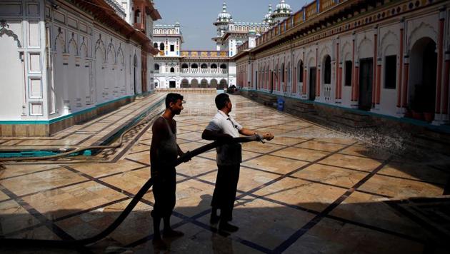 Workers use a water cannon to clean the premises of Janaki Mandir, a Hindu temple dedicated to goddess Sita in Janakpur, Nepal ahead of Prime Minister Narendra Modi’s scheduled two-day visit to Nepal beginning Friday. This will be his third visit to the country as PM. (Navesh Chitrakar / REUTERS)