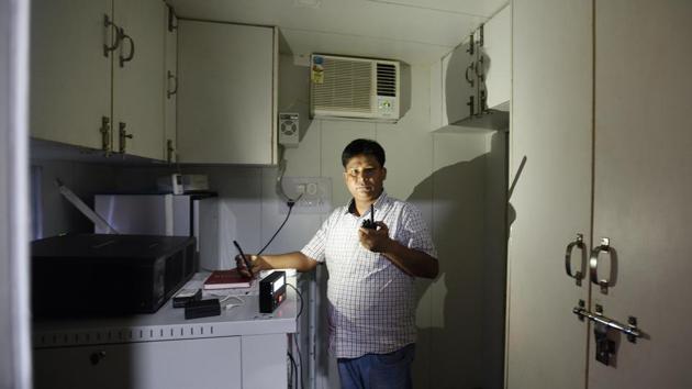 Rajesh Kumar seen inside the theatre’s projection room. A brainchild of engineer and tech entrepreneur Sushil Chaudhary, who approached Kaushik with the idea, the technology solves the problem of exhibiting movies in tier 2, 3 and 4 cities, where cinema halls are scant. The moving cinema also has a live-streaming facility. (Raj K Raj / HT Photo) Rajesh Kumar seen inside the theatre’s projection room. A brainchild of engineer and tech entrepreneur Sushil Chaudhary, who approached Kaushik with the idea, the technology solves the problem of exhibiting movies in tier 2, 3 and 4 cities, where cinema halls are scant. The moving cinema also has a live-streaming facility. (Raj K Raj / HT Photo)