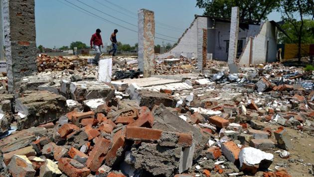 A general view of the building which collapsed during the recent storm, in Khandauli, Agra on Thursday. The death toll in the storm that hit parts of Uttar Pradesh last night has risen to 16, an official said today as the Met office issued another bad weather alert for the state. Twenty-seven others were injured in the calamity which affected nine districts. (PTI)