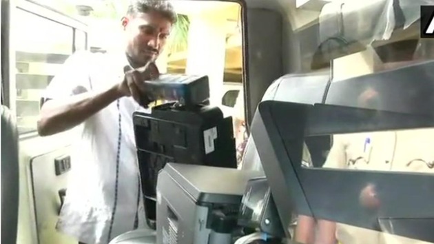 Election Commission officials seize printers from a flat at SLV Park View Apartment in Jalahalli area where 9,746 voter ID cards were found on Tuesday night.(ANI File Photo)