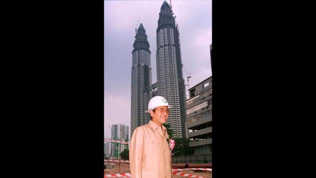 Mahathir had extravagant ambitions for Malaysia’s economy, backing the construction of the Petronas Towers (background, 1996) that were once the world’s tallest buildings and creating state-owned carmaker Proton, which never really prospered. He is credited with transforming Malaysia into a modern economy, like his contemporary, Lee Kuan Yew in Singapore. (Mike Fiala / AP File)
