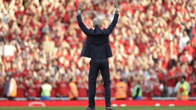 Arsenal's French manager Arsene Wenger waves to spectators before his lap of honour at the Emirates Stadium in London. The match was Wenger's last home game in charge after announcing in April he will stand down as Arsenal coach after nearly 22 years at the helm. (Matt Dunham / AP) Arsenal's French manager Arsene Wenger waves to spectators before his lap of honour at the Emirates Stadium in London. The match was Wenger's last home game in charge after announcing in April he will stand down as Arsenal coach after nearly 22 years at the helm. (Matt Dunham / AP)
