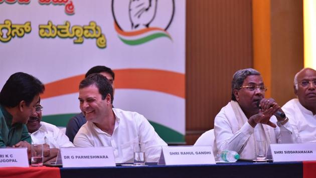 All India Congress Committee president Rahul Gandhi shares a light moment with Karnataka Pradesh Congress Committee president G Parmeshwara (second from left) and K C Venugopal (L) as Karnataka Chief Minister Siddaramaiah (R) speaks during a press conference on the last day of campaigning in Bengaluru on May 10, 2018. (Arijit Sen / HT Photo) All India Congress Committee president Rahul Gandhi shares a light moment with Karnataka Pradesh Congress Committee president G Parmeshwara (second from left) and K C Venugopal (L) as Karnataka Chief Minister Siddaramaiah (R) speaks during a press conference on the last day of campaigning in Bengaluru on May 10, 2018. (Arijit Sen / HT Photo)