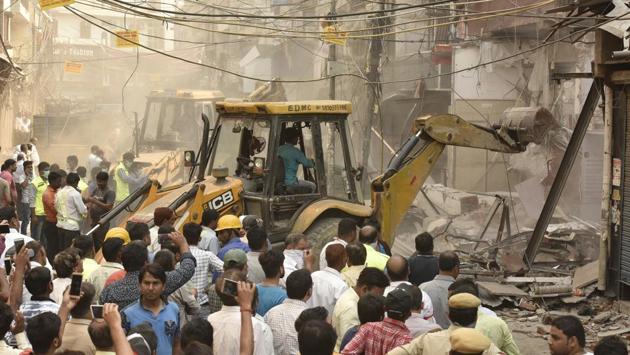 East Delhi Municipal Corporation (EDMC) officials demolish encroachments during an anti- encroachment drive at Mangal Bazar in Laxmi Nagar, New Delhi on May 10, 2018. (Raj K Raj /HT Photo) East Delhi Municipal Corporation (EDMC) officials demolish encroachments during an anti- encroachment drive at Mangal Bazar in Laxmi Nagar, New Delhi on May 10, 2018. (Raj K Raj /HT Photo)