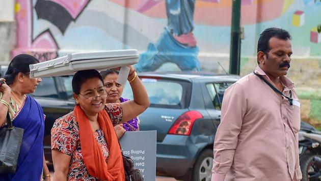 Polling officials collect EVMs and other election material on the eve of Karnataka Assembly elections in Bengaluru on May 11. (PTI Photo) Polling officials collect EVMs and other election material on the eve of Karnataka Assembly elections in Bengaluru on May 11. (PTI Photo)