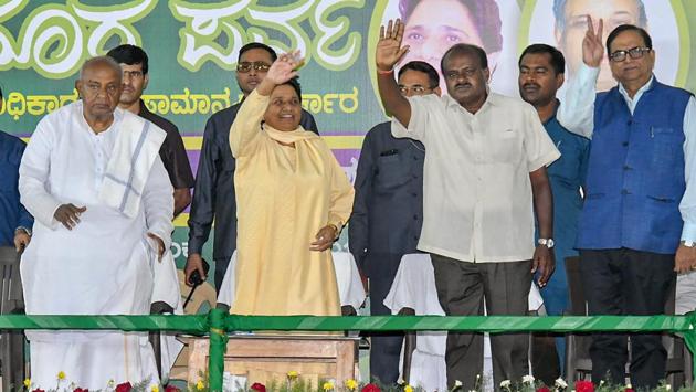 BSP chief Mayawati flanked by former Prime Minister HD Deve Gowda (L) and JD(S) state president HD Kumaraswamy (R) waves at her supporters during a campaign in Mysore on April 25, 2018. Addressing a rally, Mayawati, whose party has tied up with the Janata Dal (Secular), appealed to Dalits, Adivasis and Other Backward Classes in the state to not get swayed by the Congress and BJP as they were trying to put an end to reservations. (PTI) BSP chief Mayawati flanked by former Prime Minister HD Deve Gowda (L) and JD(S) state president HD Kumaraswamy (R) waves at her supporters during a campaign in Mysore on April 25, 2018. Addressing a rally, Mayawati, whose party has tied up with the Janata Dal (Secular), appealed to Dalits, Adivasis and Other Backward Classes in the state to not get swayed by the Congress and BJP as they were trying to put an end to reservations. (PTI)