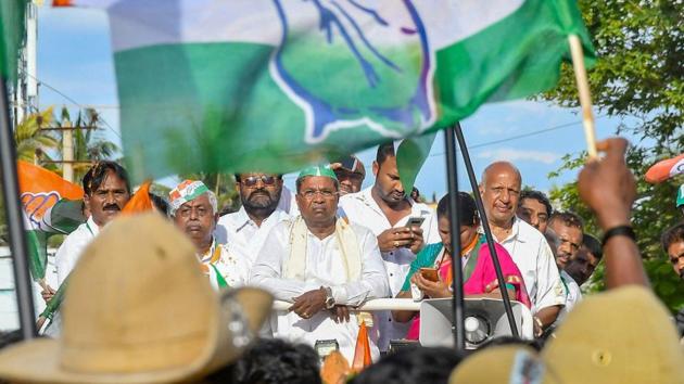 Karnataka Chief Minister Siddaramaiah during a roadshow ahead of the Karnataka assembly elections in Chamundeshwari on May 10, 2018. (PTI) Karnataka Chief Minister Siddaramaiah during a roadshow ahead of the Karnataka assembly elections in Chamundeshwari on May 10, 2018. (PTI)