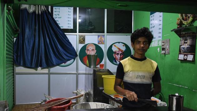Paint not required... a simple curtain will do. Or so the district authorities thought trying to hide the portraits of former Prime Minister of India and Janta Dal (secular) leader H D Deve Gowda and his son Kumarswamy at this outlet of Namma Appaji canteen. (Arijit Sen / HT Photo) 