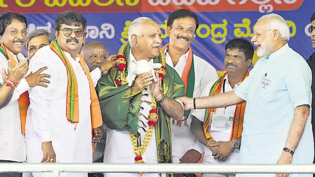 Prime Minister Narendra Modi and Bharatiya Janata Party's chief ministerial candidate BS Yeddyurappa during Karnataka election campaign rally at Chamarajanagar on May 1.(PTI file photo) Prime Minister Narendra Modi and Bharatiya Janata Party's chief ministerial candidate BS Yeddyurappa during Karnataka election campaign rally at Chamarajanagar on May 1.(PTI file photo)