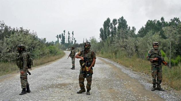 Army personnel stand guard during a recent gun battle with militants in Pulwama district.(PTI File)
