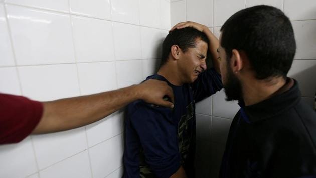 A relative of a Palestinian person who was killed at the Israel-Gaza border reacts at a hospital, in the southern Gaza Strip. (Ibraheem Abu Mustafa / REUTERS) A relative of a Palestinian person who was killed at the Israel-Gaza border reacts at a hospital, in the southern Gaza Strip. (Ibraheem Abu Mustafa / REUTERS)