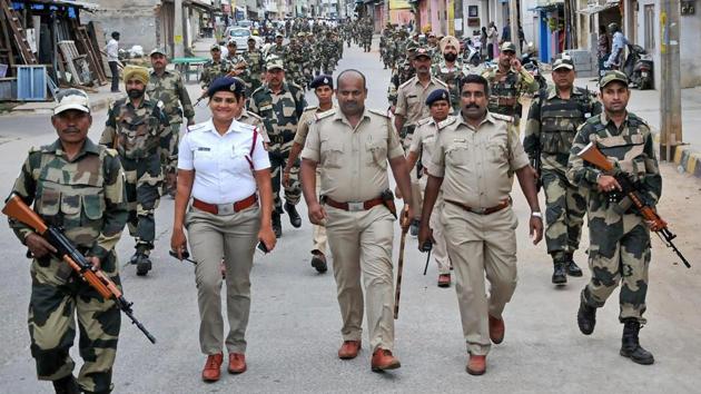 Security personnel march ahead of the Karnataka assembly elections at Chikmagalur in Karnataka on May 06, 2018. (PTI) Security personnel march ahead of the Karnataka assembly elections at Chikmagalur in Karnataka on May 06, 2018. (PTI)