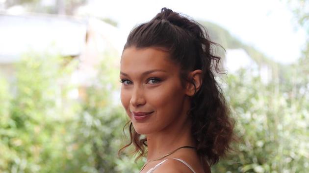 Bella Hadid poses on May 10, 2018 during a promotional event on a private beach at the 71st edition of the Cannes Film Festival in Cannes, southern France.(AFP)