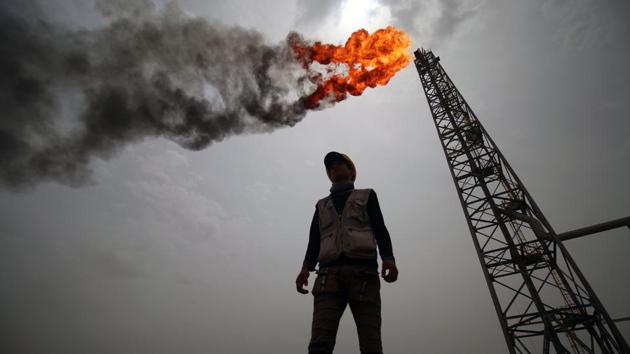 An employee stands at the Hammar Mushrif new Degassing Station Facilities site inside the Zubair oil and gas field, north of the southern Iraqi province of Basra. (Haidar Mohammed Ali / AFP) An employee stands at the Hammar Mushrif new Degassing Station Facilities site inside the Zubair oil and gas field, north of the southern Iraqi province of Basra. (Haidar Mohammed Ali / AFP)