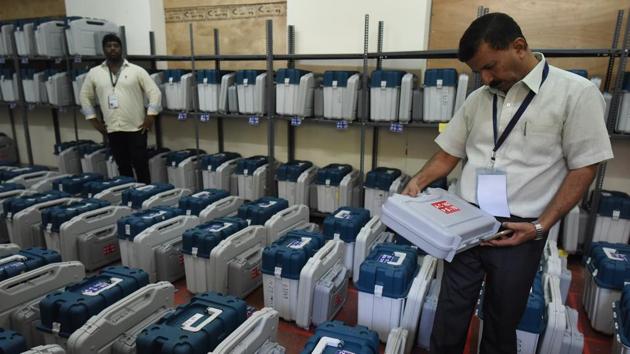 Polling staff check Electronic Voting Machines inside the strong room before distributing them at the Mustering centre in Kamlabai Girls High School in Bengaluru on Friday. Polling for 223 seats of the 224-member Assembly will be held on May 12 and results will be declared on May 15. (Arijit Sen / HT Photo) Polling staff check Electronic Voting Machines inside the strong room before distributing them at the Mustering centre in Kamlabai Girls High School in Bengaluru on Friday. Polling for 223 seats of the 224-member Assembly will be held on May 12 and results will be declared on May 15. (Arijit Sen / HT Photo)