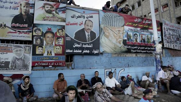 Youth gather in martyrs square during the seventh anniversary of the independence of the south from the rule of Ali Abdullah Saleh in Aden.The most reliable employment today is as a fighter in one of the militias, flush with funds from their international patrons. Otherwise, jobless men hang around all day in the streets. (Nariman El-Mofty / AP) 