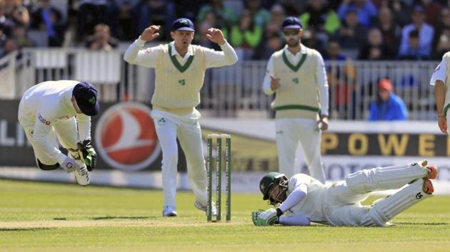 Ireland's Niall O'Brien, left, collides with Pakistan's Imam-ul-Haq on day two of the first Test at The Village, Dublin, on Saturday. (AP) Ireland's Niall O'Brien, left, collides with Pakistan's Imam-ul-Haq on day two of the first Test at The Village, Dublin, on Saturday. (AP)