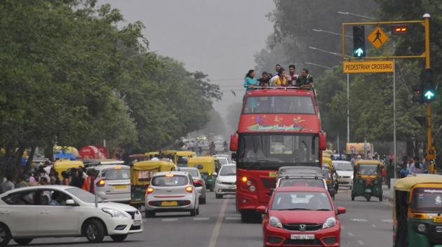 People enjoy windy weather near Sukhna lake in Chandigarh. (Karun Sharma/HT)