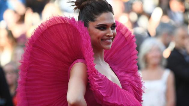 Deepika Padukone’s Cannes appearances have completely floored Ranveer Singh. His reactions to her photos are keeping social media busy.(AFP) Deepika Padukone’s Cannes appearances have completely floored Ranveer Singh. His reactions to her photos are keeping social media busy.(AFP)