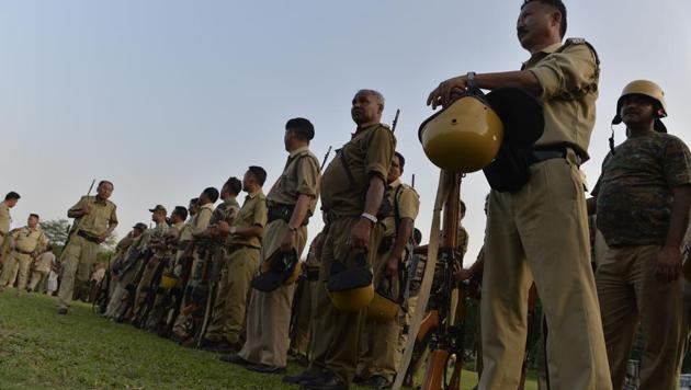 Police personnel stand in queue to collect their duty schedule for the upcoming panchayat elections in Bengal. (AFP Photo) Police personnel stand in queue to collect their duty schedule for the upcoming panchayat elections in Bengal. (AFP Photo)