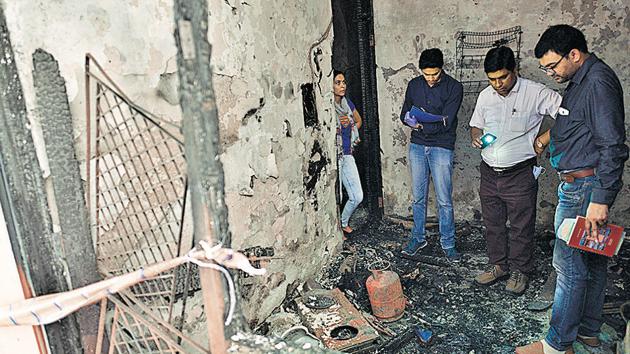 Forensic officials inspect the house at Sudarshan Park near Moti Nagar on Friday. (Sanchit Khanna/HT Photo) Forensic officials inspect the house at Sudarshan Park near Moti Nagar on Friday. (Sanchit Khanna/HT Photo)