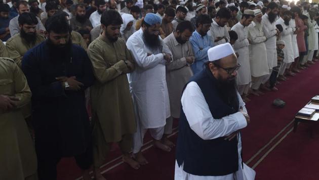 JuD chief Hafiz Saeed (centre) leads in absentia funeral prayers for Kasmiri militants in Lahore. (AFP File Photo) JuD chief Hafiz Saeed (centre) leads in absentia funeral prayers for Kasmiri militants in Lahore. (AFP File Photo)