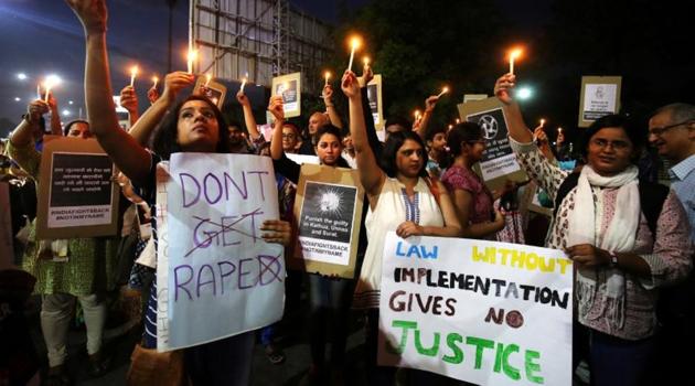 People hold candles and placards during a protest against the rape of an eight-year-old girl, in Kathua, near Jammu, a teenager in Unnao, Uttar Pradesh, and an eleven-year-old girl in Surat, Gujarat, in Ahmedabad, April 16, 2018. REUTERS/Amit Dave (Reuters File Photo) People hold candles and placards during a protest against the rape of an eight-year-old girl, in Kathua, near Jammu, a teenager in Unnao, Uttar Pradesh, and an eleven-year-old girl in Surat, Gujarat, in Ahmedabad, April 16, 2018. REUTERS/Amit Dave (Reuters File Photo)