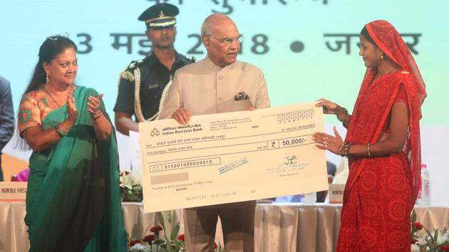 Jaipur, Rajasthan , India, 13 May 2018 : President Ram Nath Kovind along with CM VAsundhara Raje presents cheque to benificieries of Welfare Schemes at the welcom ceremony in his honour, at Birla Auditorium, in Jaipur, Rajasthan , India on Sunday 13 May 2018. (photo by -/ Hindustan times)(Himanshu Vyas /HT Photo)