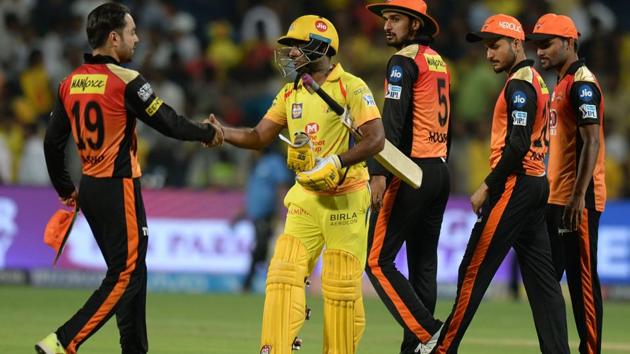 Chennai Super Kings’ Ambati Rayudu (C) shakes hands with Sunrisers Hyderabad's Rashid Khan (L) after scoring a century in their 2018 Indian Premier League match.(AFP)
