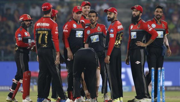 Cricketers from Royal Challengers Bangalore celebrate the dismissal of Delhi Daredevils' Prithvi Shaw during the IPL 2018 cricket match in New Delhi, India on May 12, 2018. RCB won by 5 wickets. (AP)