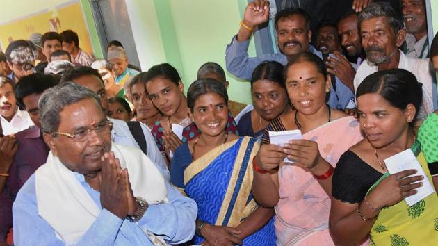 Karnataka election: Chief minister Siddaramaiah greets his supporters after voting at Hundi village in Mysore on Saturday. (PTI Photo) Karnataka election: Chief minister Siddaramaiah greets his supporters after voting at Hundi village in Mysore on Saturday. (PTI Photo)