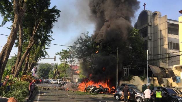 Motorcycles burn following a blast at the Pentecost Church Central Surabaya (GPPS), in Surabaya, East Java, Indonesia May 13, 2018, in this photo provided by Antara Foto.(REUTERS)