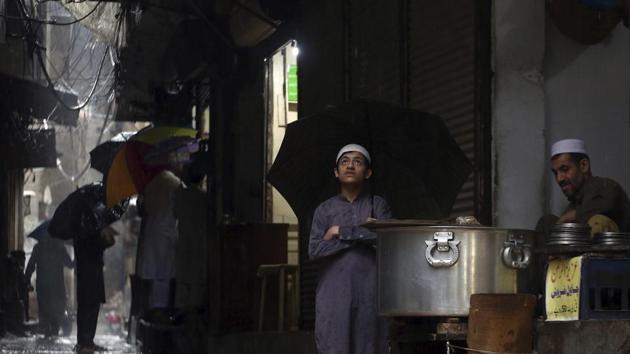 A Pakistani boy waits at a tea stall during rain in Peshawar, Pakistan. (AP File Photo) A Pakistani boy waits at a tea stall during rain in Peshawar, Pakistan. (AP File Photo)