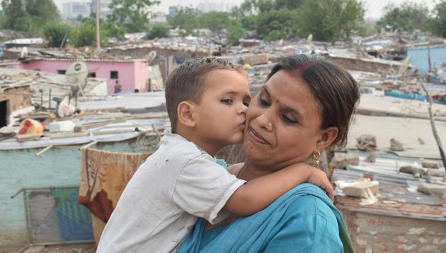 A son kisses his mother, at Shaheed Udham Singh colony sector 74 in Mohali.(Sikander Singh Chopra/HT)