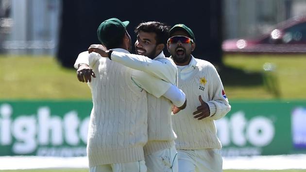 Pakistan's Shadab Khan (C) celebrates with team mates after taking the wicket of Ireland's Stuart Thompson. Get full cricket score of Ireland vs Pakistan, one-off Test, Day 3 in Malahide, here.(REUTERS)