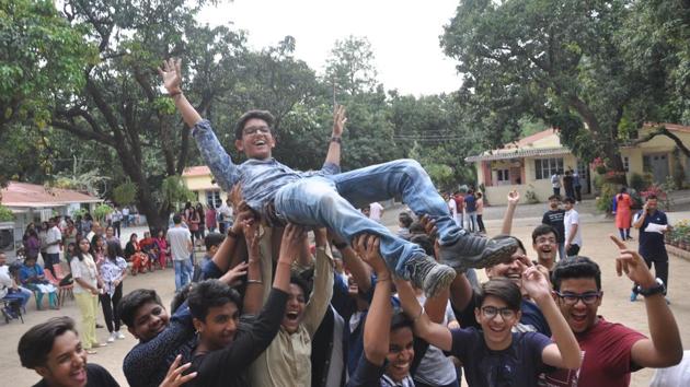 Brightlands school students celebrate after the CISCE results were announced in Dehradun on Monday.(HT Photo)