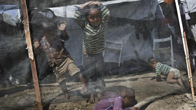 The plan has drawn fire from human rights groups, which argue that containment is to blame for poor living conditions on the islands. “This situation causes distress, violates people’s rights, and insults the dignity of some of the world’s most vulnerable people. It’s an open wound for Greece and human rights,” Dimitra Spatharidou, from the Greek office of Amnesty International, told a parliamentary committee. (Petros Giannakouris / AP) 