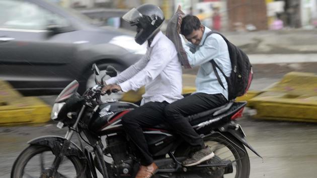 Motorists make their way through the rain in Pune, Maharashtra. According to the India Meteorological Department (IMD), thunderstorms also occurred at isolated places in Himachal Pradesh, Uttarakhand, Punjab, Haryana, Chandigarh, Madhya Pradesh, Jharkhand, Assam, Meghalaya, Maharashtara, Karnataka, Kerala and Tamil Nadu. (Ravindra Joshi / HT Photo) Motorists make their way through the rain in Pune, Maharashtra. According to the India Meteorological Department (IMD), thunderstorms also occurred at isolated places in Himachal Pradesh, Uttarakhand, Punjab, Haryana, Chandigarh, Madhya Pradesh, Jharkhand, Assam, Meghalaya, Maharashtara, Karnataka, Kerala and Tamil Nadu. (Ravindra Joshi / HT Photo)